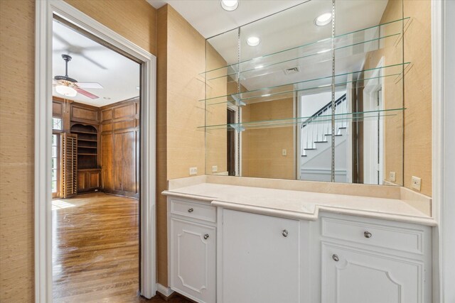 4932 Post Oak Timber Dr, Houston, TX 77056 - bathroom with vanity, wood finished floors, a ceiling fan, and recessed lighting