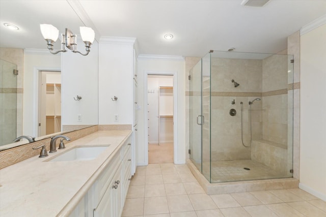 4932 Post Oak Timber Dr, Houston, TX 77056 - full bath featuring a spacious closet, tile patterned floors, vanity, a stall shower, and ornamental molding