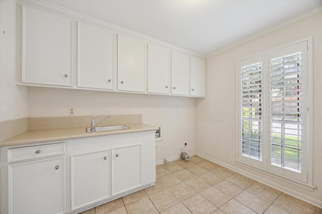 4932 Post Oak Timber Dr, Houston, TX 77056 - washroom with washer hookup, cabinet space, crown molding, and light tile patterned flooring