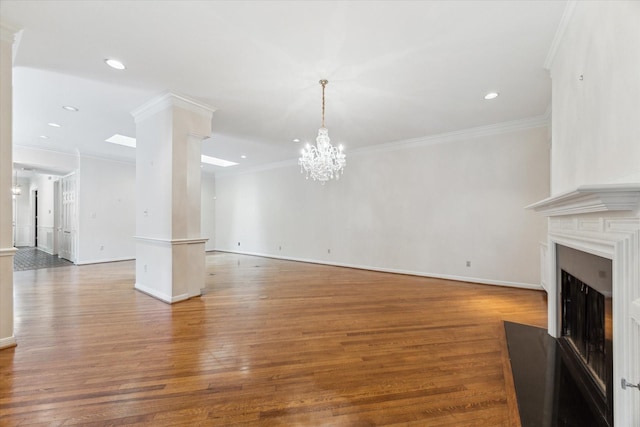 4932 Post Oak Timber Dr, Houston, TX 77056 - unfurnished living room featuring a chandelier, wood finished floors, a fireplace, recessed lighting, and ornamental molding