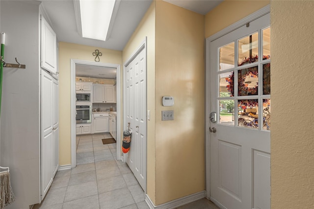 459 Brookwood Dr, Diboll, TX 75941 - hall featuring light tile patterned floors and baseboards