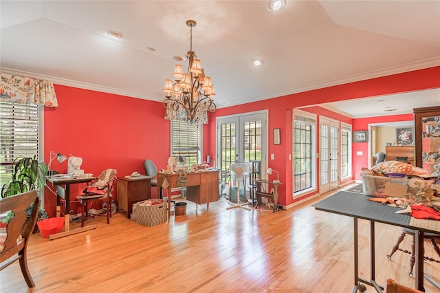 459 Brookwood Dr, Diboll, TX 75941 - dining space with wood finished floors, a chandelier, crown molding, and french doors