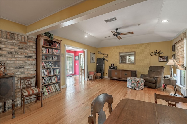 459 Brookwood Dr, Diboll, TX 75941 - living area with light wood-style flooring, ceiling fan, a wood stove, vaulted ceiling, and recessed lighting
