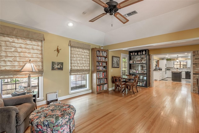 459 Brookwood Dr, Diboll, TX 75941 - living area with ceiling fan, light wood finished floors, plenty of natural light, lofted ceiling, and recessed lighting