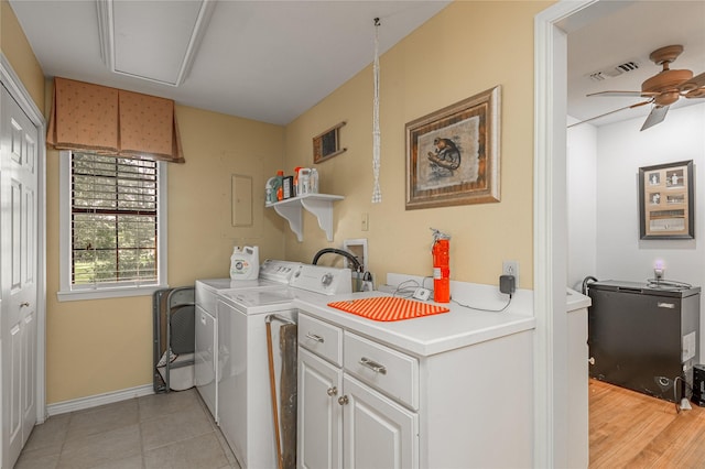 459 Brookwood Dr, Diboll, TX 75941 - laundry area featuring washing machine and dryer, ceiling fan, cabinet space, and light tile patterned flooring