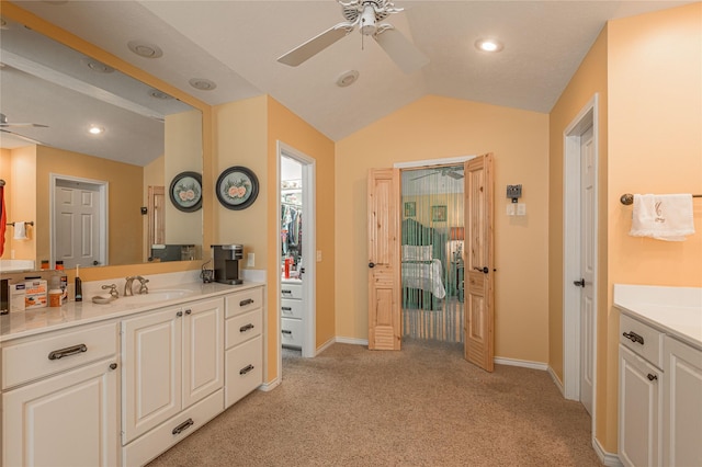 459 Brookwood Dr, Diboll, TX 75941 - bathroom featuring a ceiling fan, vanity, vaulted ceiling, carpet, and recessed lighting