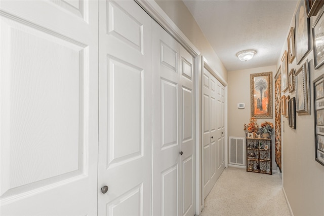 459 Brookwood Dr, Diboll, TX 75941 - hall with light colored carpet and a textured ceiling