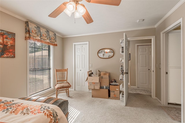 459 Brookwood Dr, Diboll, TX 75941 - carpeted bedroom with crown molding, a closet, and a ceiling fan