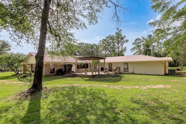 459 Brookwood Dr, Diboll, TX 75941 - back of house featuring a pergola and a lawn