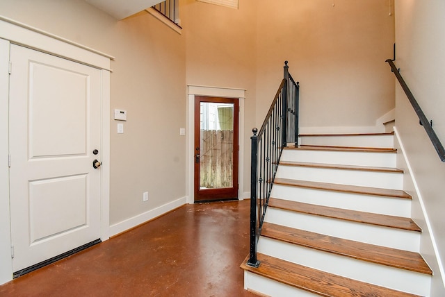 5238 Nett St, Houston, TX 77007 - entrance foyer featuring concrete floors and stairs