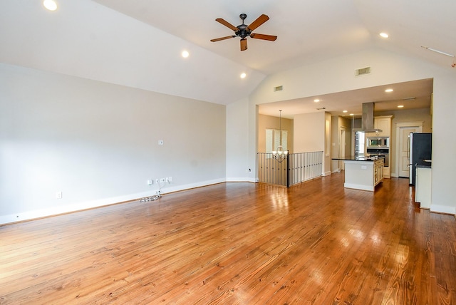 5238 Nett St, Houston, TX 77007 - unfurnished living room with a chandelier, wood-type flooring, a ceiling fan, recessed lighting, and high vaulted ceiling