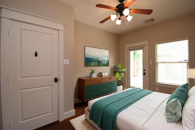 5238 Nett St, Houston, TX 77007 - bedroom with access to outside, a ceiling fan, and dark wood-type flooring