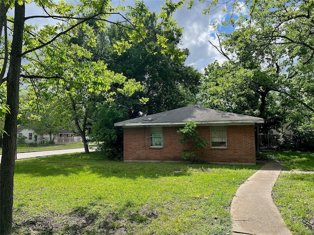 1815 Parker Rd, Houston, TX 77093 - view of property exterior with brick siding and a yard