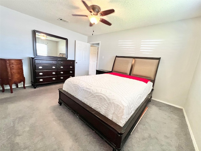 805 Duroux Rd, La Marque, TX 77568 - carpeted bedroom featuring a textured ceiling and a ceiling fan