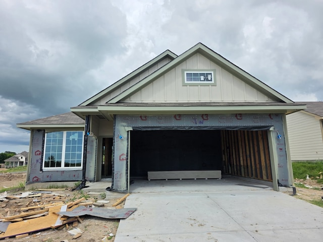 1414 Whitney Ln, Brenham, TX 77833 - property in mid-construction with board and batten siding, concrete driveway, and a garage