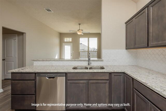 1414 Whitney Ln, Brenham, TX 77833 - kitchen with stainless steel dishwasher, ceiling fan, decorative backsplash, a peninsula, and dark brown cabinets