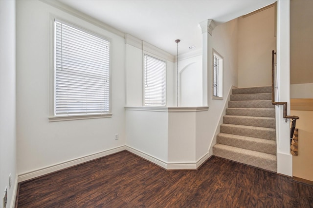 1518 Dunlavy St, Houston, TX 77006 - unfurnished room featuring dark wood-style flooring, healthy amount of natural light, and stairway