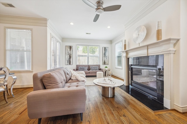1518 Dunlavy St, Houston, TX 77006 - living room featuring crown molding, ceiling fan, wood finished floors, recessed lighting, and a fireplace