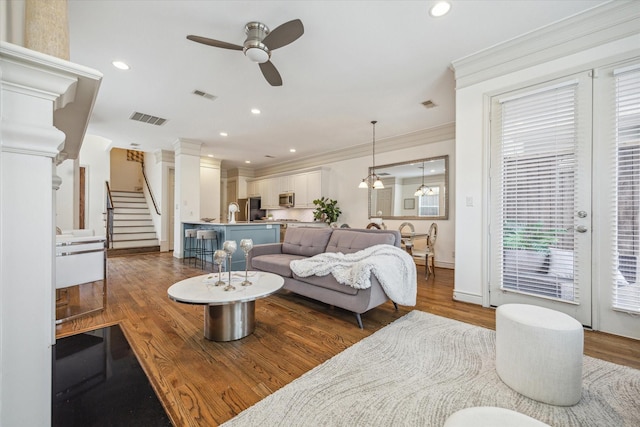 1518 Dunlavy St, Houston, TX 77006 - living area featuring ceiling fan, ornamental molding, wood finished floors, recessed lighting, and stairway
