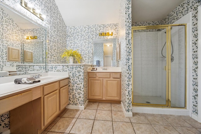 2016 Fairwood St, Pearland, TX 77581 - bathroom featuring wallpapered walls, a stall shower, two vanities, and tile patterned flooring