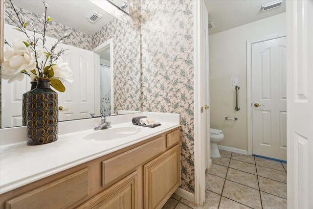 2016 Fairwood St, Pearland, TX 77581 - full bathroom featuring vanity, wallpapered walls, and tile patterned floors