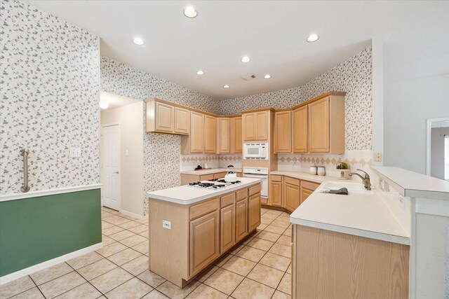 2016 Fairwood St, Pearland, TX 77581 - kitchen featuring wallpapered walls, white appliances, light tile patterned flooring, light countertops, and light brown cabinetry