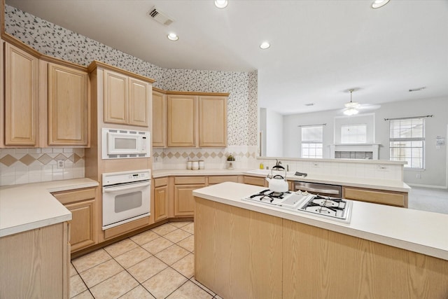 2016 Fairwood St, Pearland, TX 77581 - kitchen with white appliances, light brown cabinets, backsplash, a ceiling fan, and recessed lighting