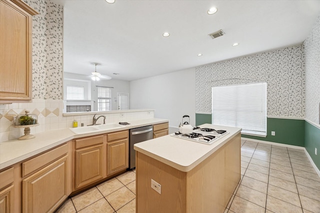 2016 Fairwood St, Pearland, TX 77581 - kitchen with dishwasher, light tile patterned floors, a peninsula, light countertops, and wallpapered walls