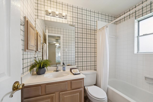 2016 Fairwood St, Pearland, TX 77581 - bathroom featuring vanity, healthy amount of natural light, shower / tub combo with curtain, tile walls, and ceiling fan