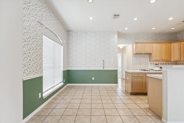 2016 Fairwood St, Pearland, TX 77581 - kitchen featuring wallpapered walls, healthy amount of natural light, light countertops, light tile patterned floors, and recessed lighting