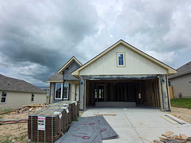 1412 Whitney Ln, Brenham, TX 77833 - property under construction with board and batten siding, driveway, and a garage