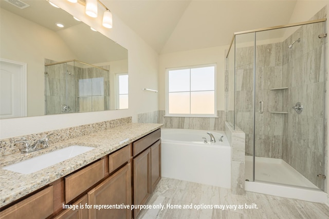 1412 Whitney Ln, Brenham, TX 77833 - full bathroom with a stall shower, a garden tub, vanity, and lofted ceiling