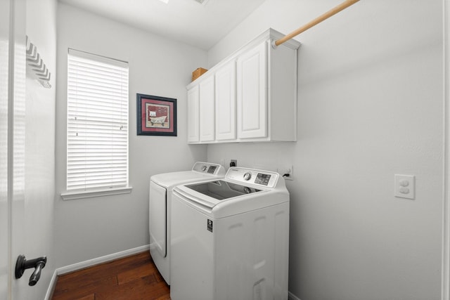 6531 Glenhill Dr, Spring, TX 77389 - laundry room with washer and dryer, cabinet space, and dark wood-type flooring