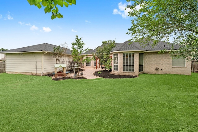 6531 Glenhill Dr, Spring, TX 77389 - back of property with a patio, roof with shingles, and brick siding
