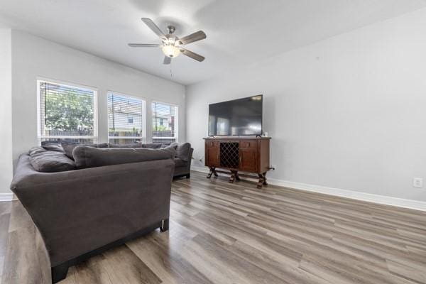 19602 Hardwood Ridge Trl, Cypress, TX 77429 - living area with ceiling fan and wood finished floors