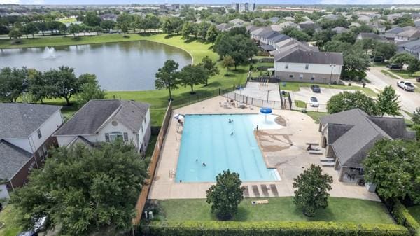 19602 Hardwood Ridge Trl, Cypress, TX 77429 - aerial view of residential area featuring a large body of water and a pool area