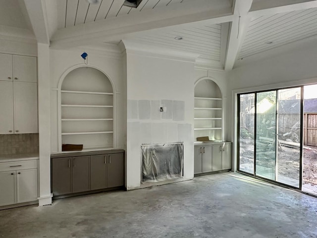 2434 Quenby St, Houston, TX 77005 - unfurnished living room with concrete flooring, a wood ceiling with exposed beams, and built in shelves