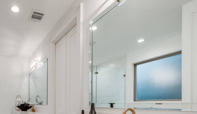 2434 Quenby St, Houston, TX 77005 - full bath featuring recessed lighting, a shower with shower door, and vanity