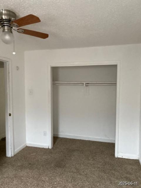 6605 Hogue St, Houston, TX 77087 - unfurnished bedroom with a closet, dark carpet, a textured ceiling, and ceiling fan