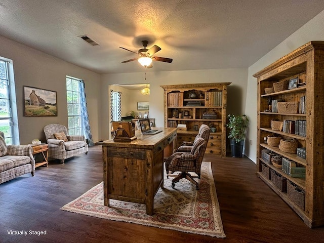 1215 Briar Ln, Wharton, TX 77488 - office area featuring dark wood-style flooring, ceiling fan, and a textured ceiling