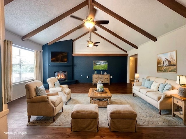 1215 Briar Ln, Wharton, TX 77488 - living room with wood finished floors, ceiling fan, and a fireplace