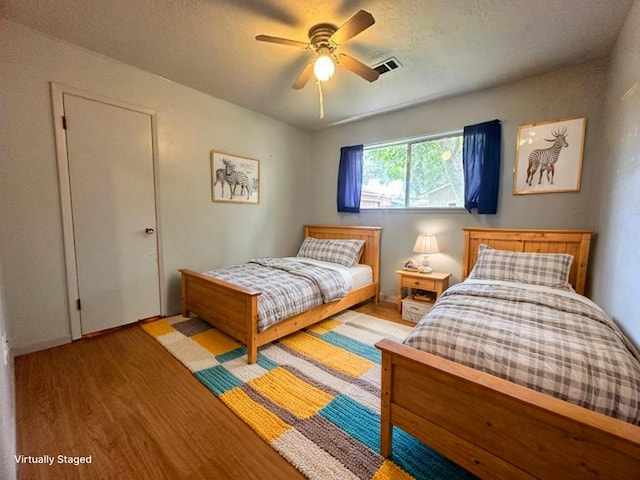 1215 Briar Ln, Wharton, TX 77488 - bedroom featuring wood finished floors and ceiling fan