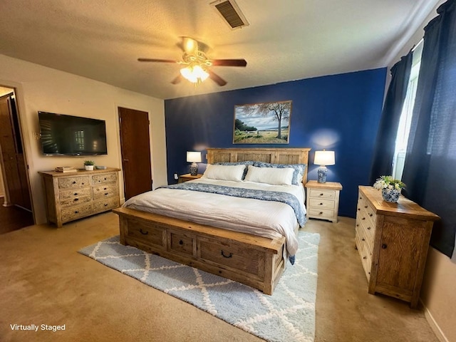 1215 Briar Ln, Wharton, TX 77488 - bedroom with light carpet and ceiling fan