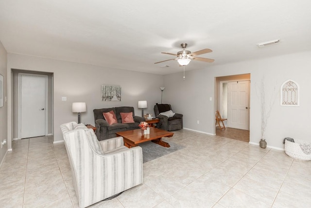 804 Camphor Cir, Village Mills, TX 77663 - living room with light tile patterned floors and a ceiling fan