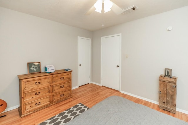 804 Camphor Cir, Village Mills, TX 77663 - bedroom featuring light wood-type flooring and ceiling fan