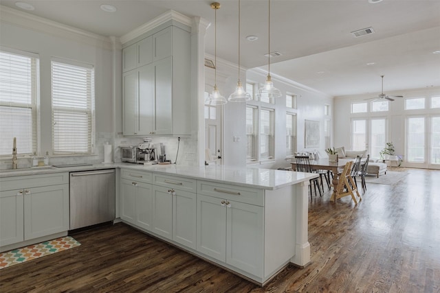 1207 W 25th St, Houston, TX 77008 - kitchen featuring stainless steel dishwasher, a peninsula, dark wood-style flooring, a ceiling fan, and ornamental molding