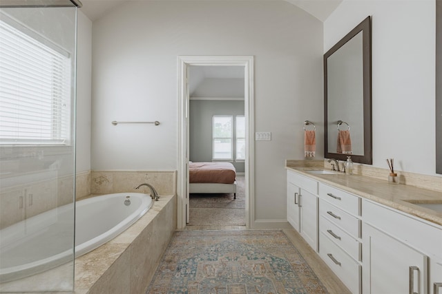 1207 W 25th St, Houston, TX 77008 - full bathroom featuring double vanity, a garden tub, lofted ceiling, and connected bathroom