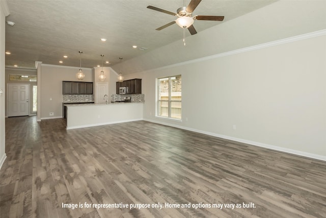 1449 Lake Ridge Dr, Brenham, TX 77833 - unfurnished living room with recessed lighting, ceiling fan, dark wood-type flooring, and crown molding