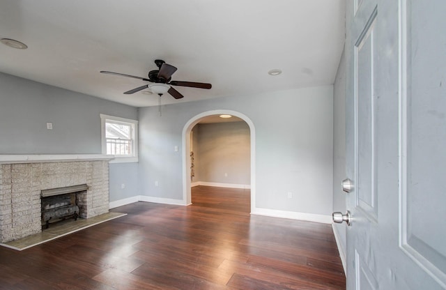 1117 Elliston St, Houston, TX 77023 - unfurnished living room with ceiling fan, arched walkways, and wood finished floors