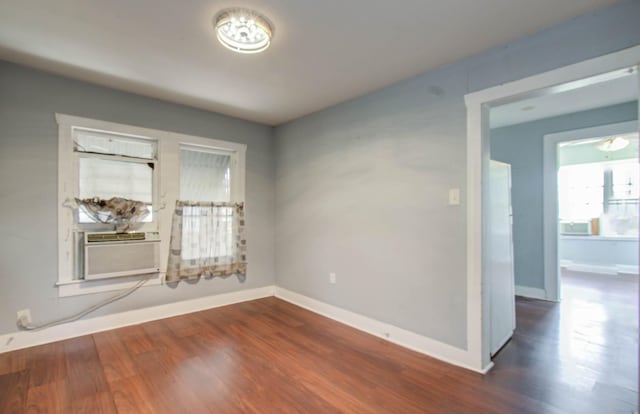 1117 Elliston St, Houston, TX 77023 - empty room with dark wood-style floors and cooling unit